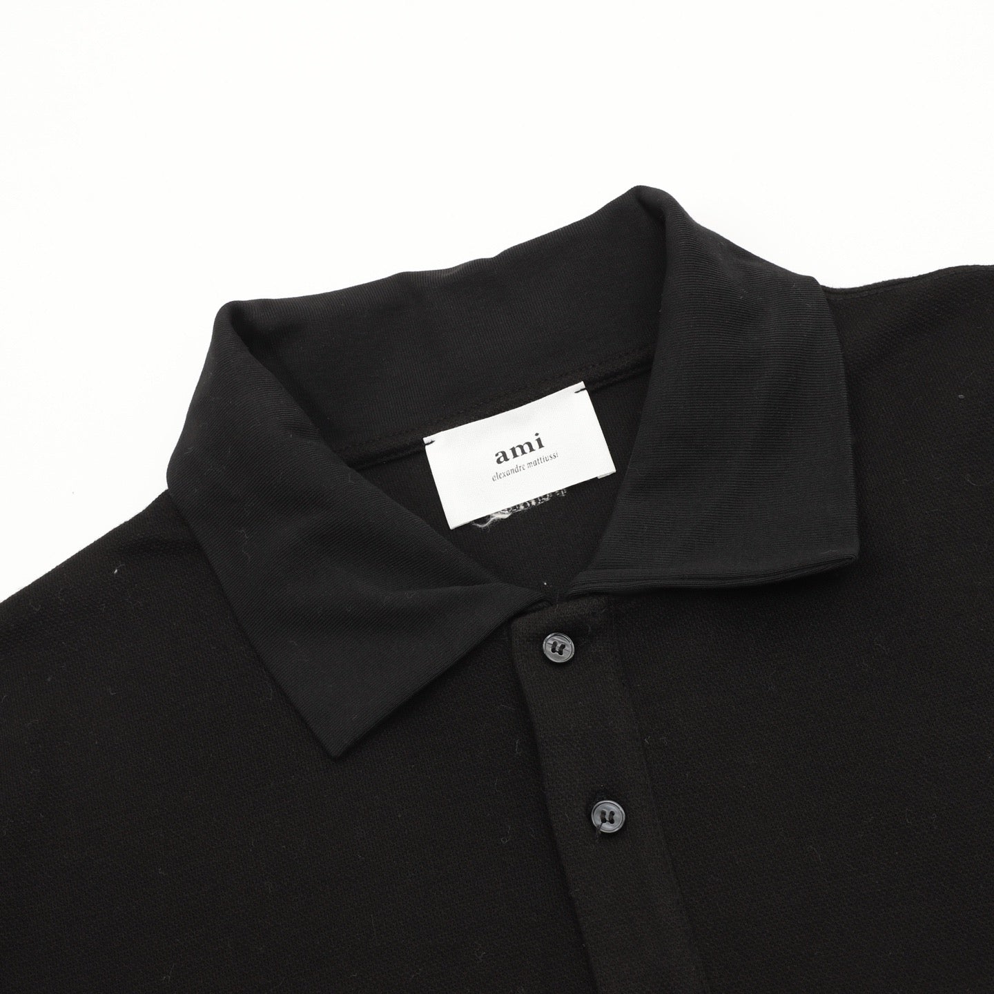 AMI Paris Long-Sleeve Polo Shirt — Tonal Heart Logo, Black | FW25