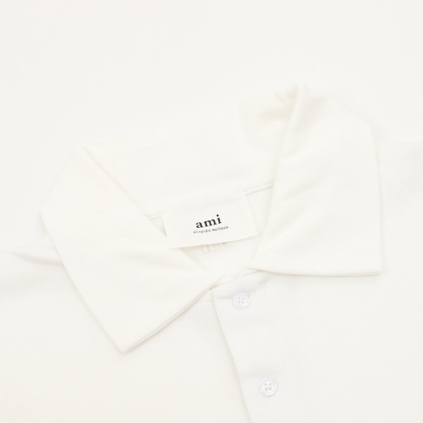 AMI Paris Long-Sleeve Polo Shirt — Tonal Heart Logo, Black | FW25