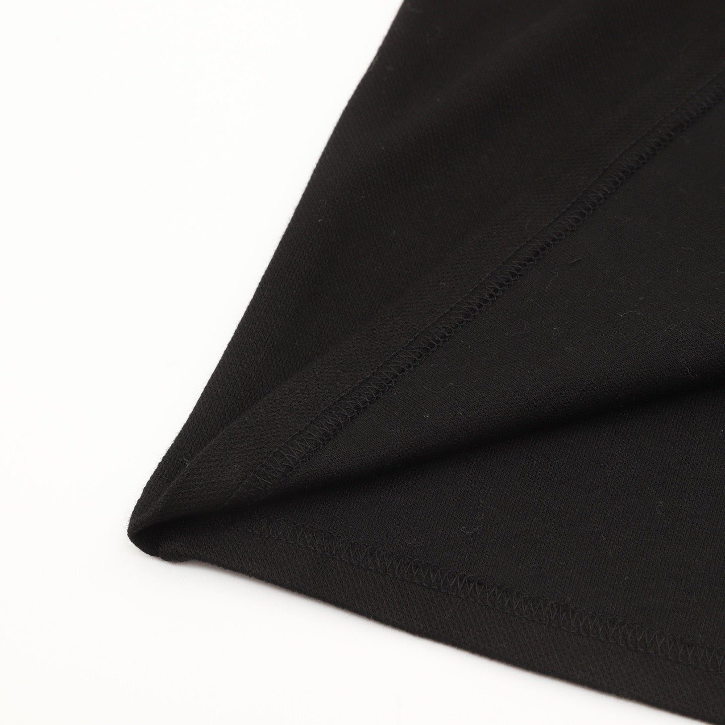 AMI Paris Long-Sleeve Polo Shirt — Tonal Heart Logo, Black | FW25